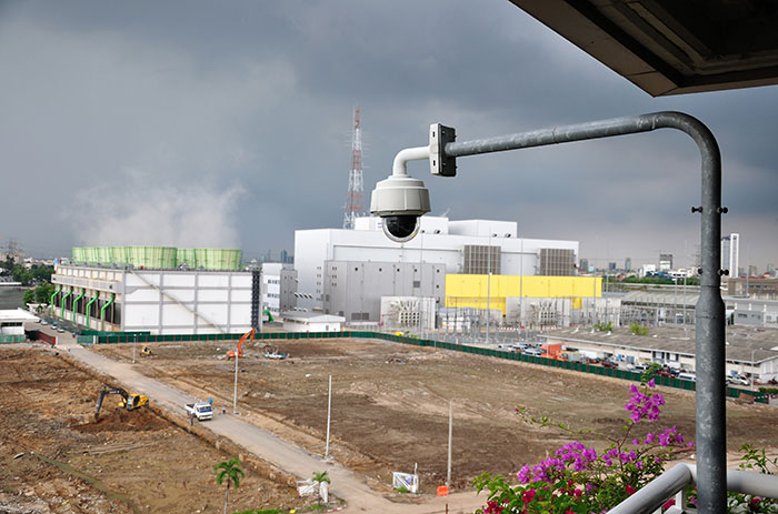 construction site with CCTV camera watching over it